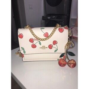 Coach Mini Klare crossbody bag with heart cherry print and keychain